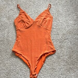 Orange body suit women’s